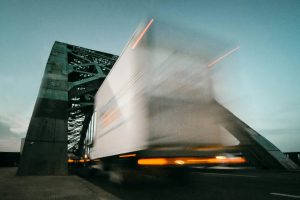 time lapse photography of truck going on bridge